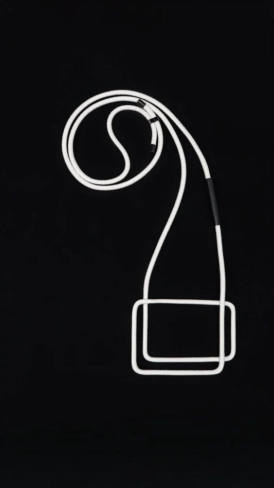 Minimalist white modular necklace with rectangular pendant on black background from FuturisNow Linea collection