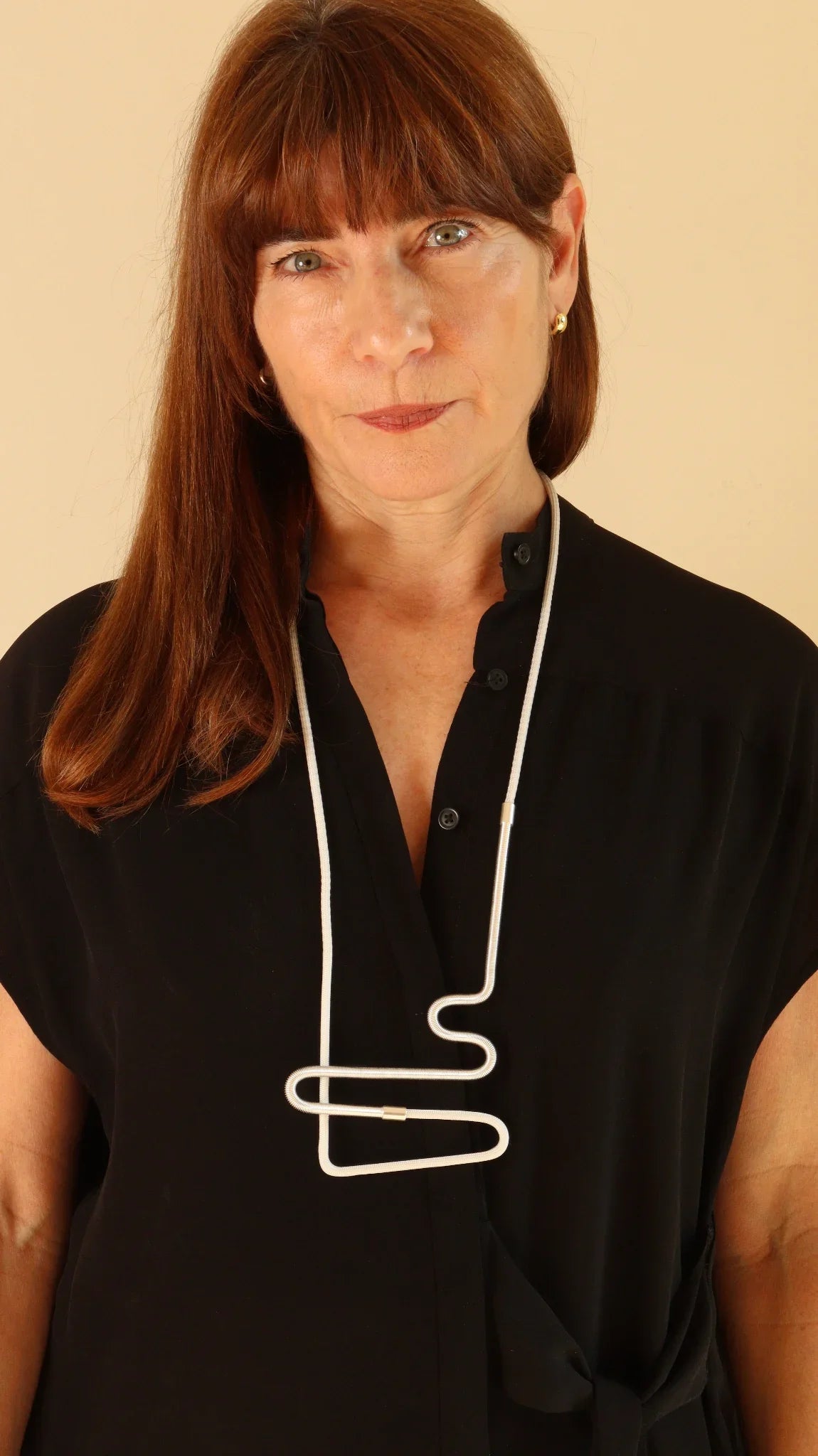 Joelle wearing Linea 2 necklace in white and silver from the Metallic Series Industrial modern jewelry. 