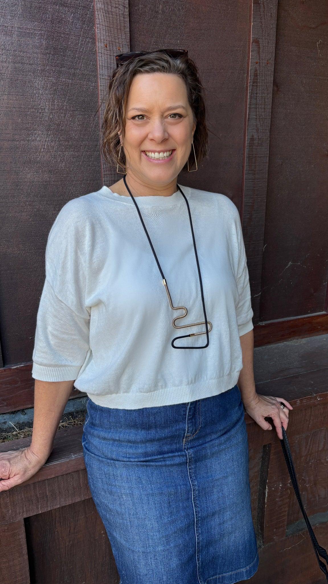 Heather wearing Linea 2 necklace in black and Gold from the Metallic Series Industrial modern jewelry. 