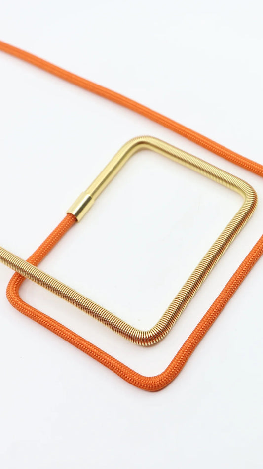 Linea 27 necklace in orange and gold from the metallic series industrial jewelry by futurisnow. 